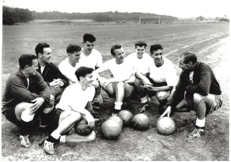 Bob Seith (second left) as Harry Potts talks to his players in August 1959