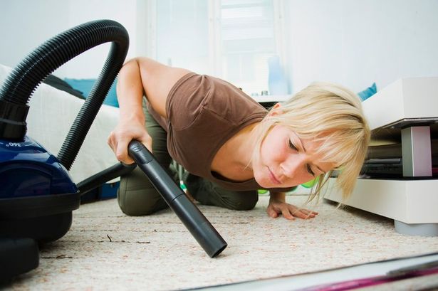 Woman-lying-on-the-floor-vacuuming.jpg