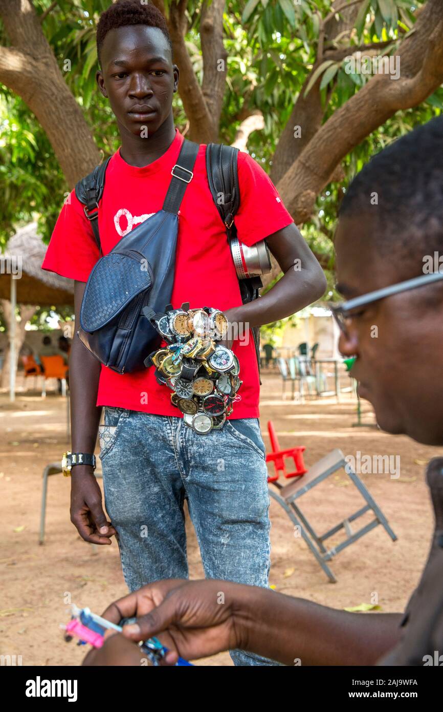 young-man-selling-watches-in-koudougou-burkina-faso-2AJ9WFA.jpg