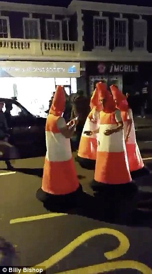 2E0AB90A00000578-3300305-The_footage_showed_the_group_standing_on_the_high_street_wearing-a-114_1446475113607.jpg