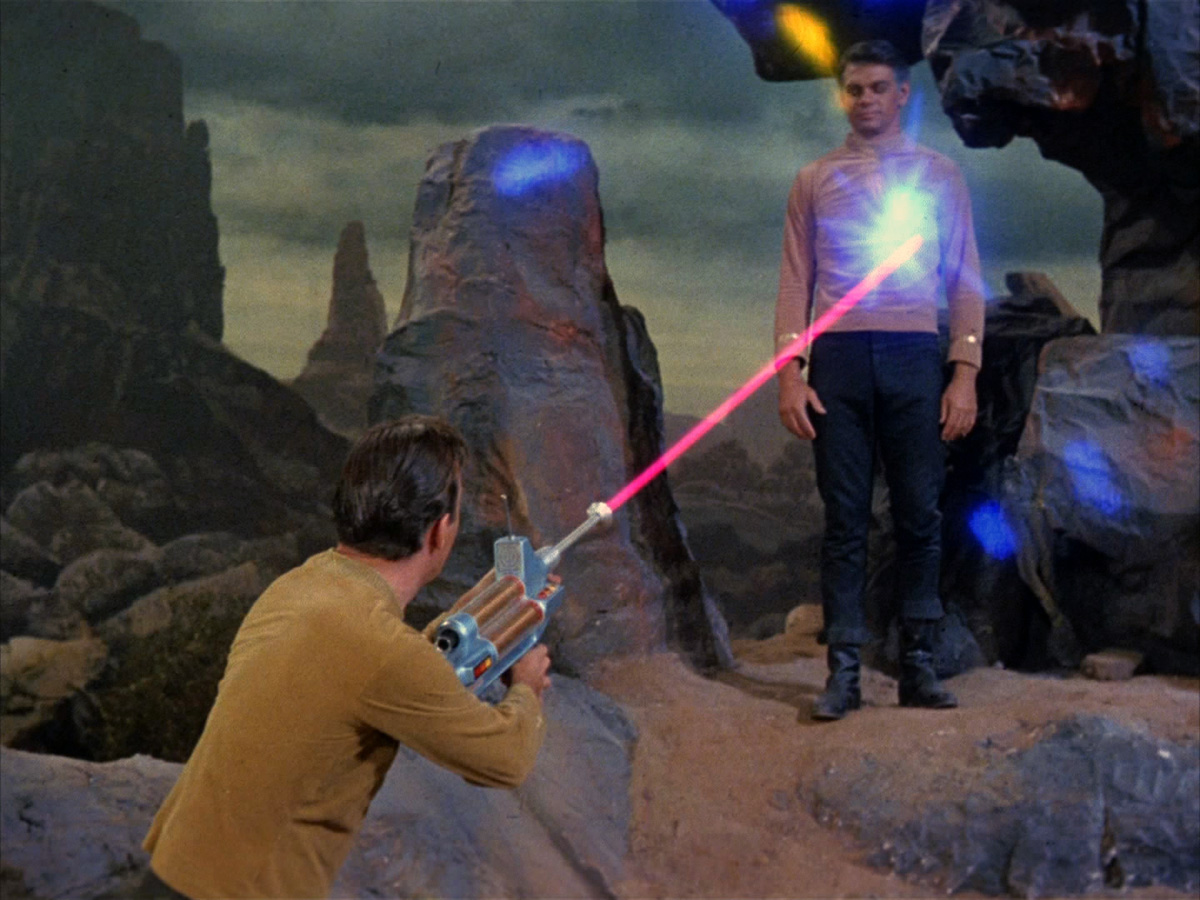 Kirk_fires_a_phaser_rifle_at_Mitchell.jpg